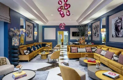 a living room with couches and tables at Leonardo Boutique Hotel Rome Monti in Rome