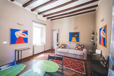 a living room with a couch and a table at Colosseum nest in Rome