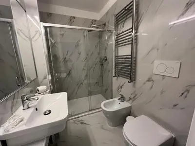 a bathroom with a sink and a toilet and a shower at Affreschi al Vaticano in Rome