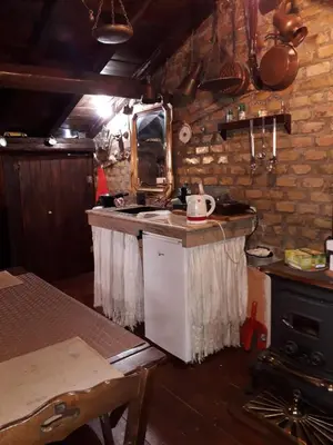 a kitchen with a counter with a sink and a stove at B&BGarbatella in Rome