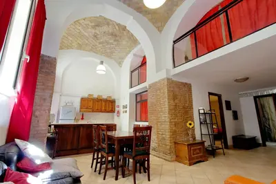 a kitchen and dining room with a table and chairs at Lucky Holidays in Rome