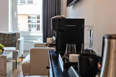 a coffee maker on a counter in a living room at Fellini Design Suites in Rome
