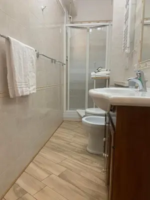 a bathroom with a toilet and a sink and a shower at B&B Acasadibarbara in Rome