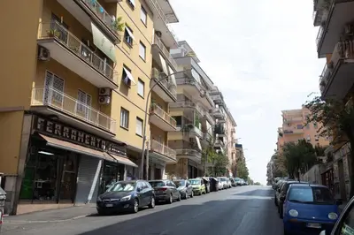 a street with cars parked on the sides of buildings at Rooms Monteverde 2 in Rome