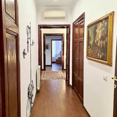 a hallway of a house with a painting on the wall at Residenza San Pietro in Rome