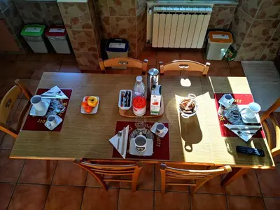 an overhead view of a wooden table with food and drinks at Vecchia Roma Resort in Rome