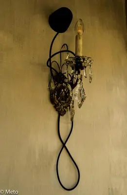 a chandelier is hanging on a wall at B&B Abbraccia Morfeo in Rome