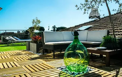 a glass bottle sitting on top of a wooden table at B&B Abbraccia Morfeo in Rome