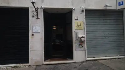 an entrance to a building with an open door at Moai Home in Rome