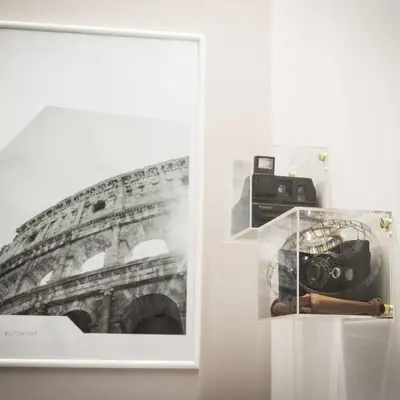 a picture of a photo of a building and a camera at VaticanArt in Rome