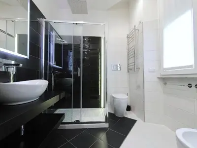 a bathroom with a shower and a sink and a toilet at B&B Aurelia Garden Rooms in Rome