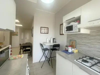 a kitchen with a stove and a counter top at Bibbi's House San Lorenzo in Rome