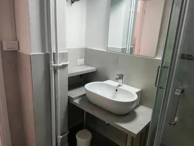 a bathroom with a sink and a mirror at Bibbi's House San Lorenzo in Rome