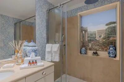 a bathroom with a shower and a sink at Colonna Traiana - The View Boutique Luxury Home in the center of ancient Rome in Rome