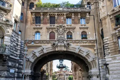 an archway in front of a large building at Flat Two in Rome