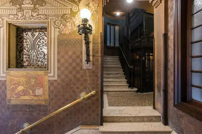 a hallway of a building with stairs and a door at Flat Two in Rome