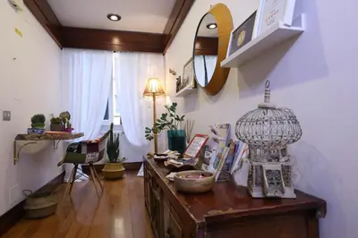a room with a table with a bird cage on it at Tata B&B in Rome