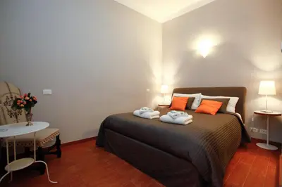 a bedroom with a bed with towels on it at Clemy In Rome in Rome
