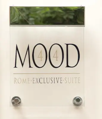 a sign for the morodrome exclusive suite at Mood44 in Rome