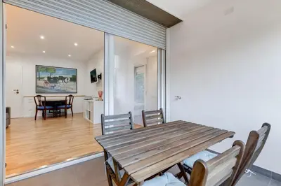a dining room with a wooden table and chairs at Giulio Cesare Apartment in Rome