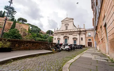 a group of motorcycles parked in front of a building at la casa di Romolo in Rome