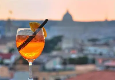 a drink with a slice of lime in a glass at White Vatican in Rome