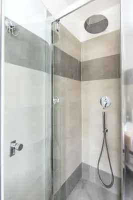 a shower with a glass door in a bathroom at LIVING ROME Int 2 in Rome