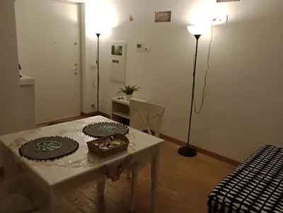 a living room with a table with a cake on it at LIVING ROME Int 2 in Rome
