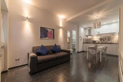 a living room with a couch and a table at Romantic Apartment in Rome, 50 sqm, Parking in Rome