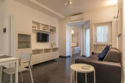 a living room with a couch and a table at Romantic Apartment in Rome, 50 sqm, Parking in Rome