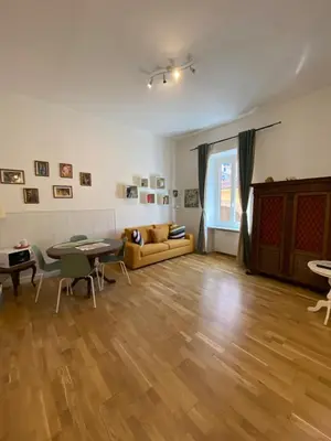 a living room with a couch and a table at La casa di Remo in Rome