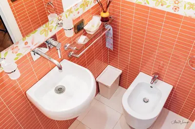 a bathroom with a toilet and a bidet at Magik rooms in Rome