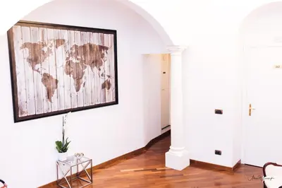 a room with a world map on the wall at Magik rooms in Rome