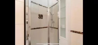 a shower with a glass door in a bathroom at Center Rome Coliseum in Rome