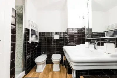 a bathroom with a toilet and a sink at Casa Prati Michelangelo in Rome