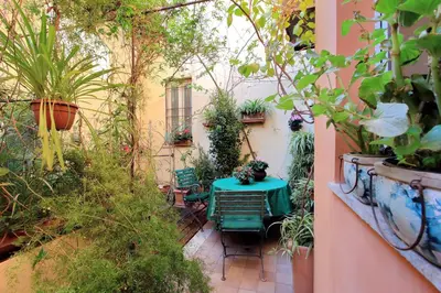 a small garden with a table and plants at Casa dell'Angelo in Rome