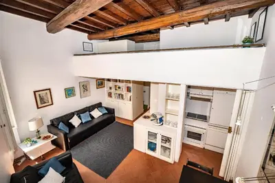an overhead view of a living room with a black couch at Appartamento via dei Baullari in Rome