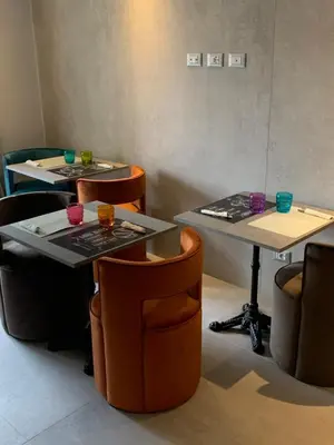 two tables in a room with chairs and drinks on them at Relais Aquarium in Rome