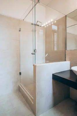 a bathroom with a glass shower and a sink at Restart Accommodations Celimontana in Rome