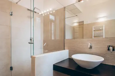 a bathroom with a sink and a glass shower at Restart Accommodations Celimontana in Rome