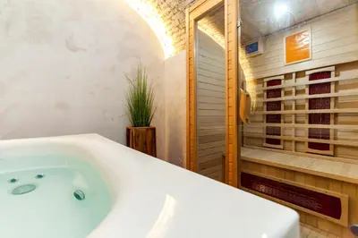 a white bath tub in a bathroom with a shower at Rifugio degli Artisti B&B in Rome