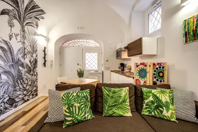 a living room with a couch and a table at FRESH HOUSE NAVONA in Rome
