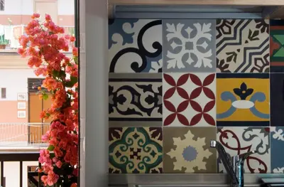 a wall with a bunch of different types of tiles at Gli Alberi a Testaccio in Rome