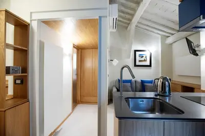 a kitchen with a sink and a counter top at Flat PIAZZA DEL POPOLO in Rome
