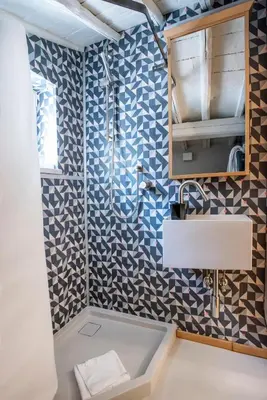 a bathroom with a sink and a shower at Flat PIAZZA DEL POPOLO in Rome