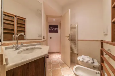 a bathroom with a sink and a toilet at Amazing studio in Campo de Fiori - FromHometoRome in Rome