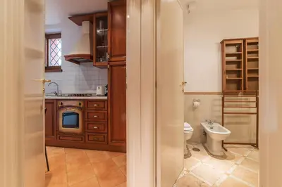 a bathroom with a sink and a toilet in a room at Amazing studio in Campo de Fiori - FromHometoRome in Rome