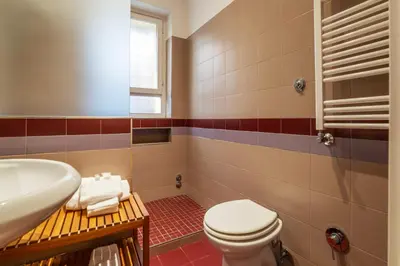 a bathroom with a toilet and a sink at Apartment with terrace near Piazza Navona - FromHometoRome in Rome