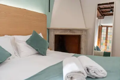 a bedroom with a bed with towels on it at Campo de' Fiori 34 in Rome
