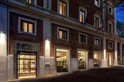 a large brick building with a lot of windows at DoubleTree By Hilton Rome Monti in Rome